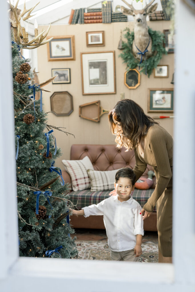 Mother and son in front of Christmas tree