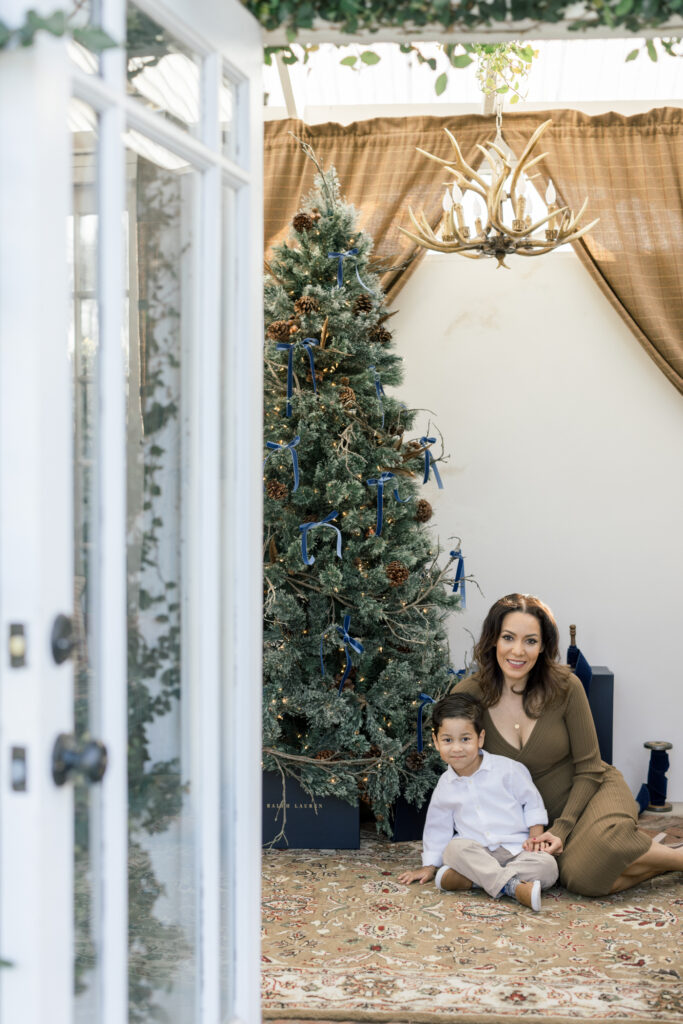 Mother and Son in front of Christmas tree