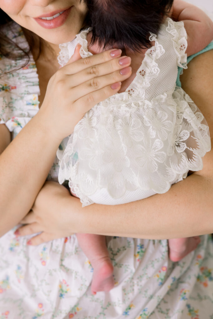 mother snuggling with baby